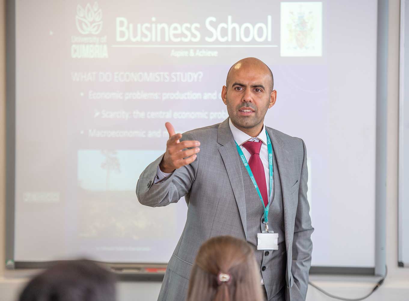 Zaeed-Mohammed-with-business-school-backdrop-Becker-pic